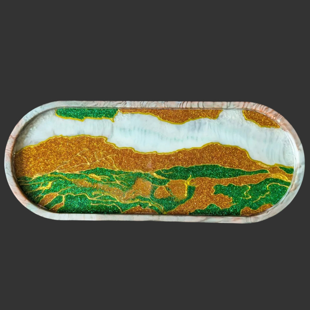 Handcrafted oval resin tray in emerald green, copper gold, and pearl white with marbled rim